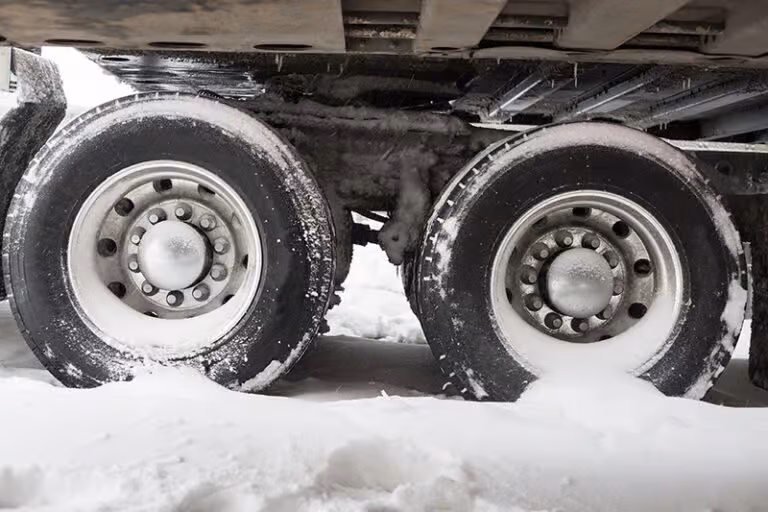 How can I avoid having a serious car crash with a large truck or semi tractor-trailer while driving in Kansas, Image
